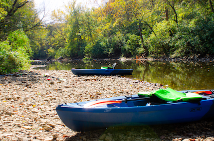 Kayaks on the bank of the Blue River