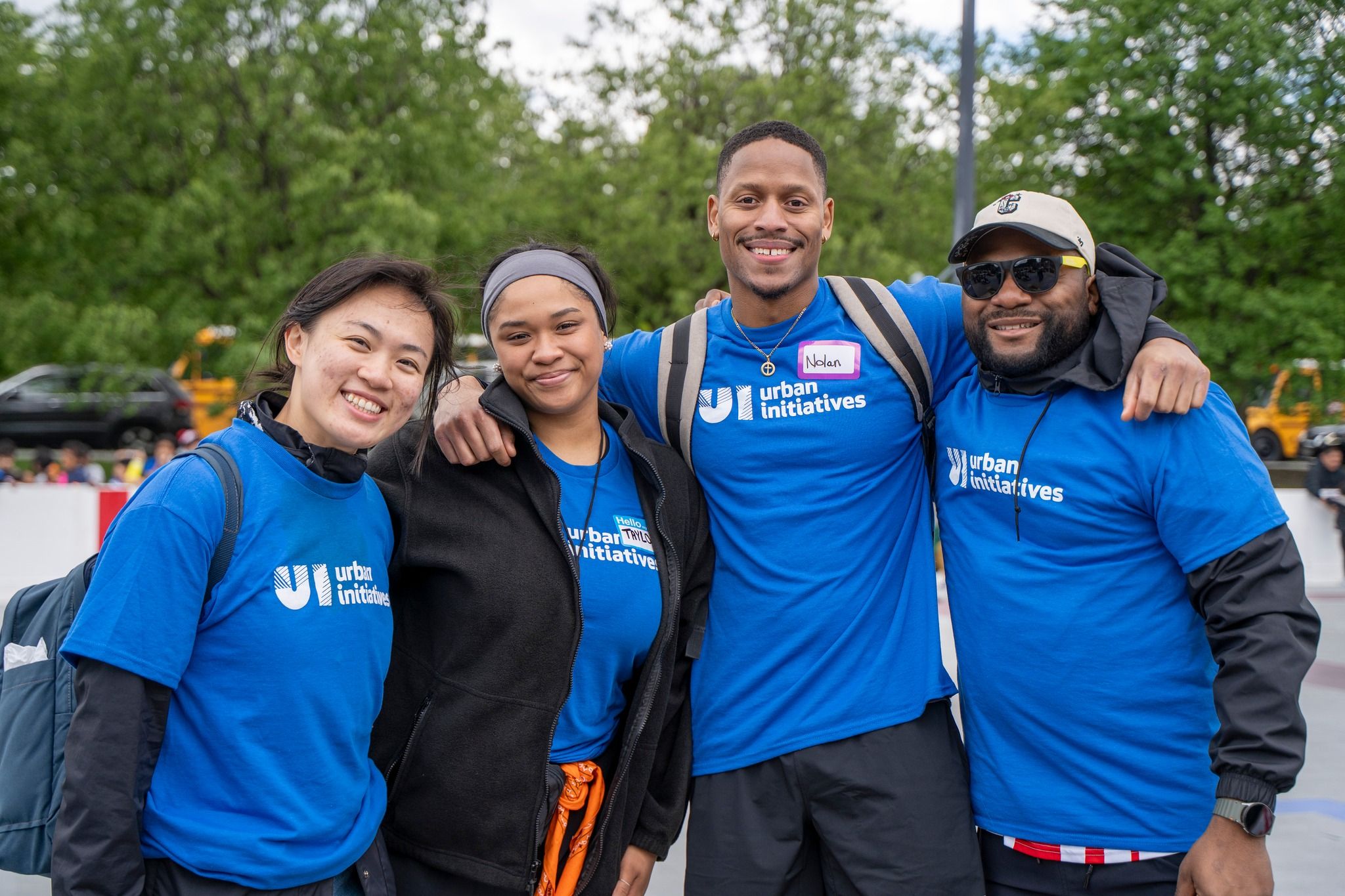 Volunteers in a group photo smiling at camera