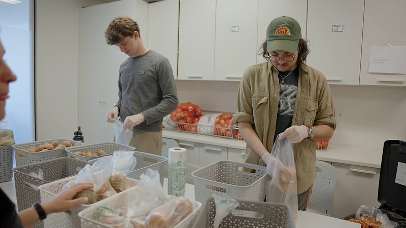 Picture of two people packaging food bags