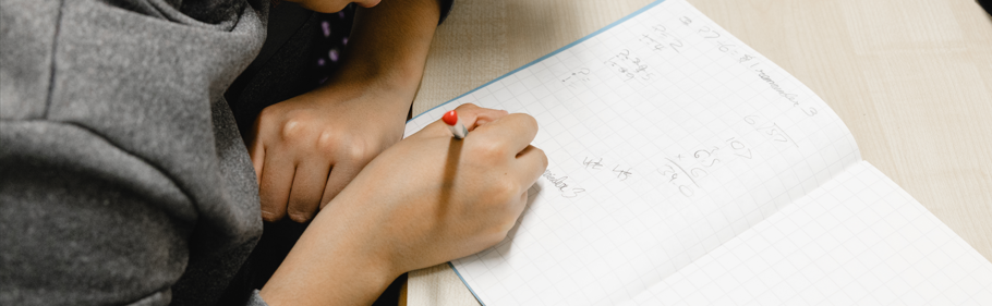 image of a pupil writing