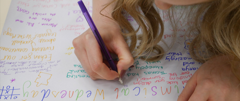 image of a pupil writing