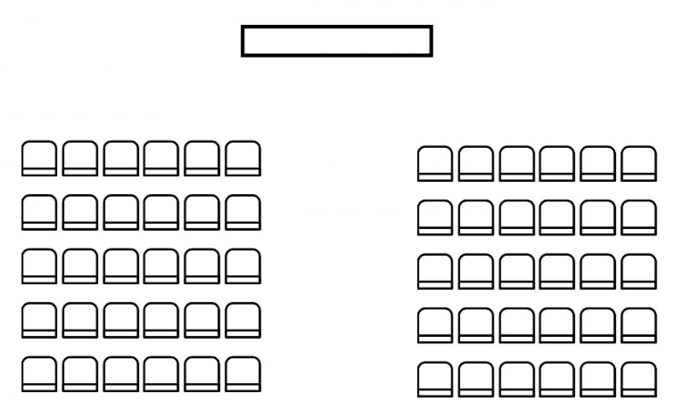 Theater style classroom setup - presenter in the front of the room with all participants in rows of chairs facing them.